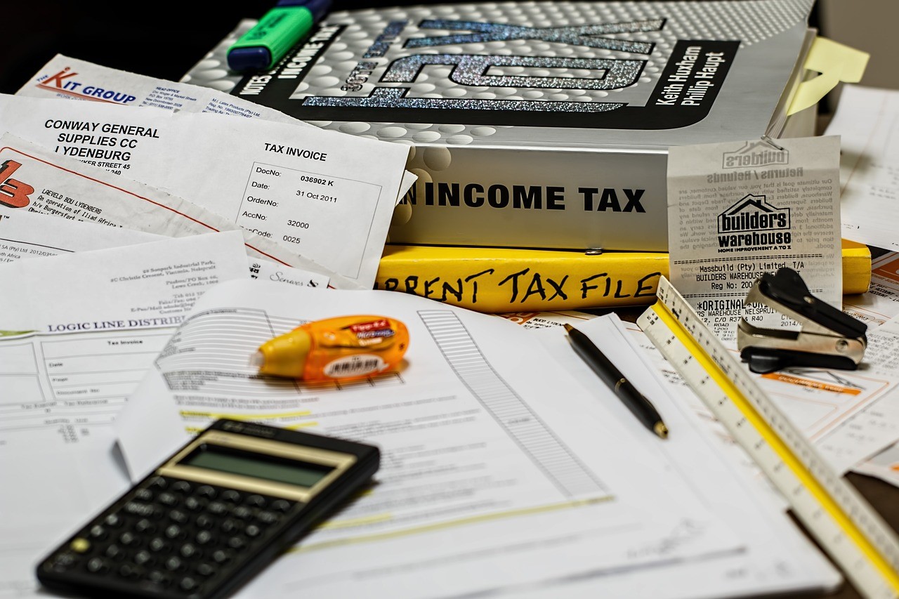 Calculator and documents to obtain a loan.