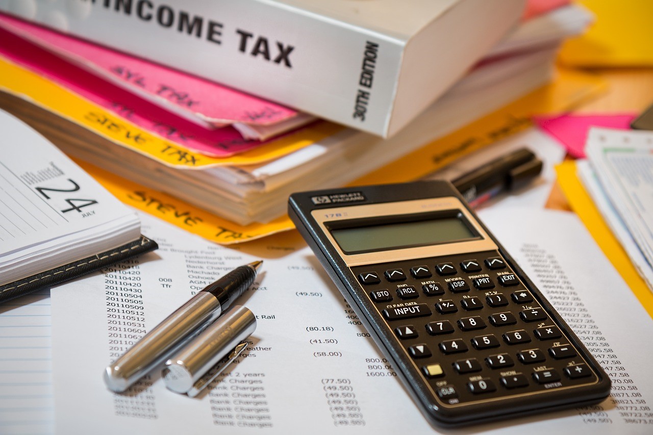 Tax documents arranged on a desk.